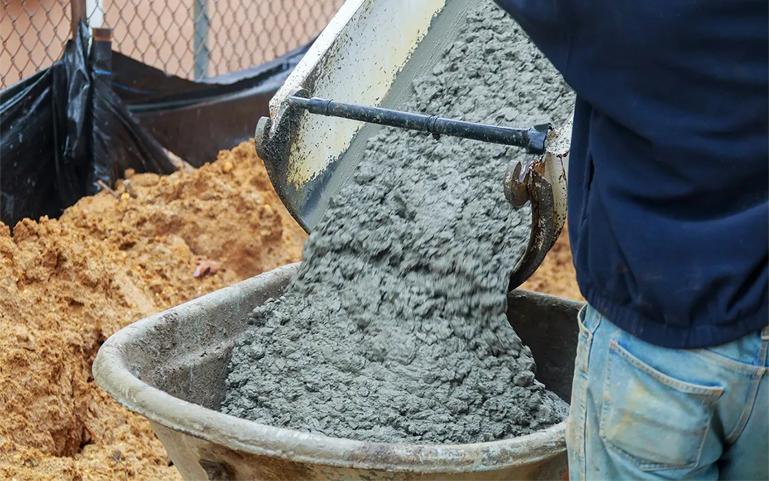 concrete-being-poured-from-a-truck-into-a-concrete-pump-at-a-construction-site